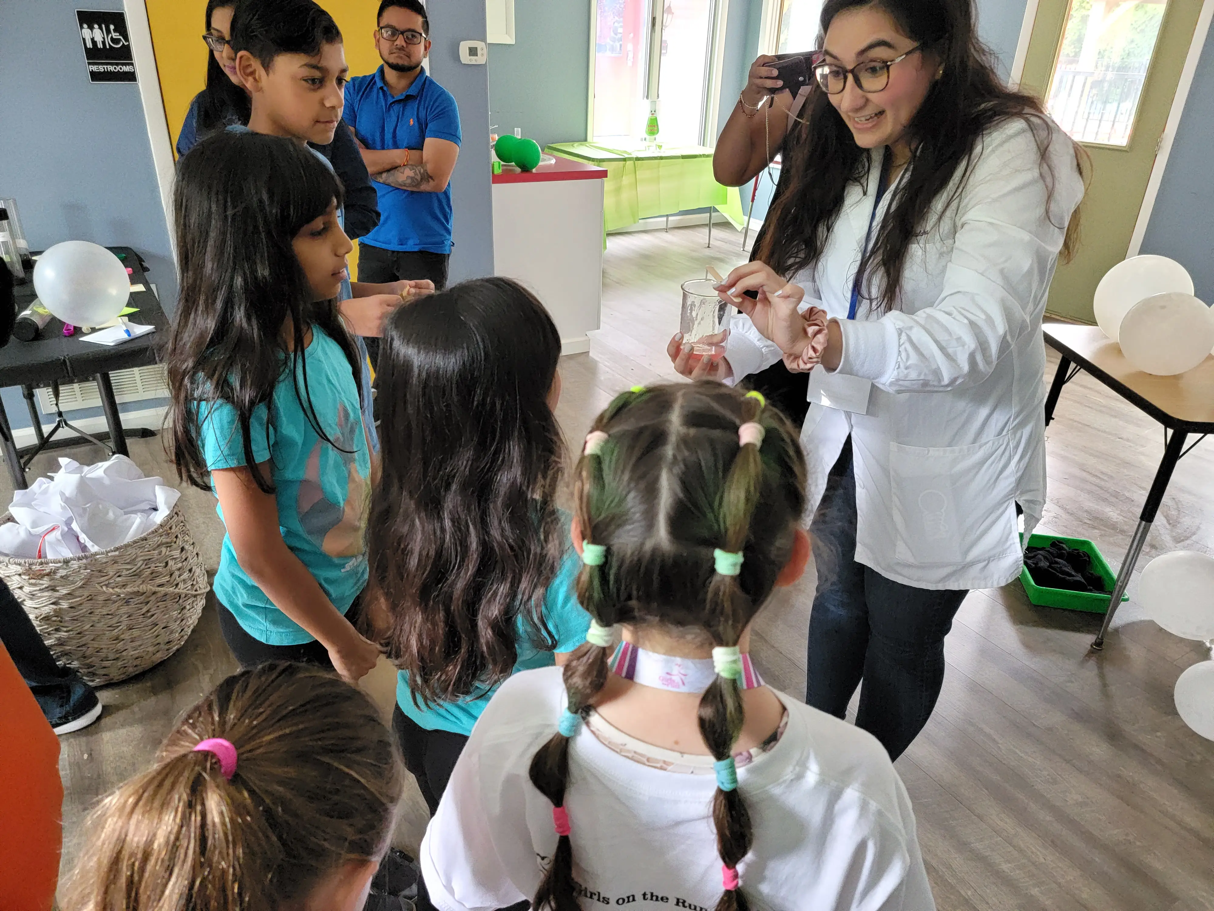 Professional scientist teaching children