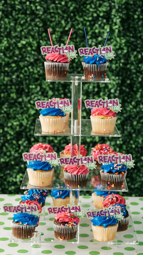 Cupcake tower with Reaction Lab decorations for birthday parties